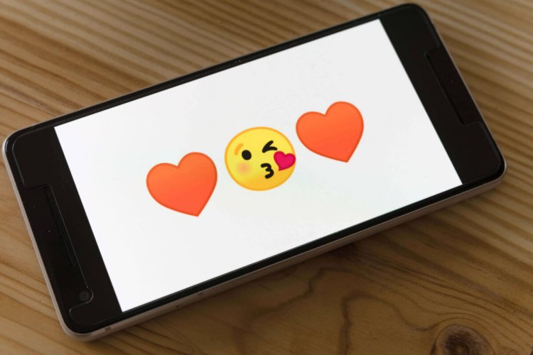 Cheeky emojis on a mobile phone screen